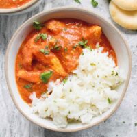 Chicken Tikka Masala served over rice in a bowl