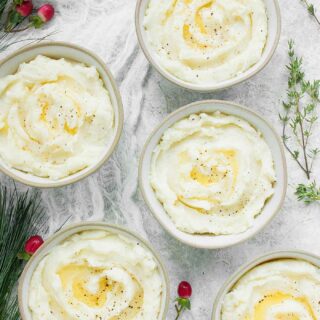 Single serving bowls of Roasted Garlic Mashed Potatoes