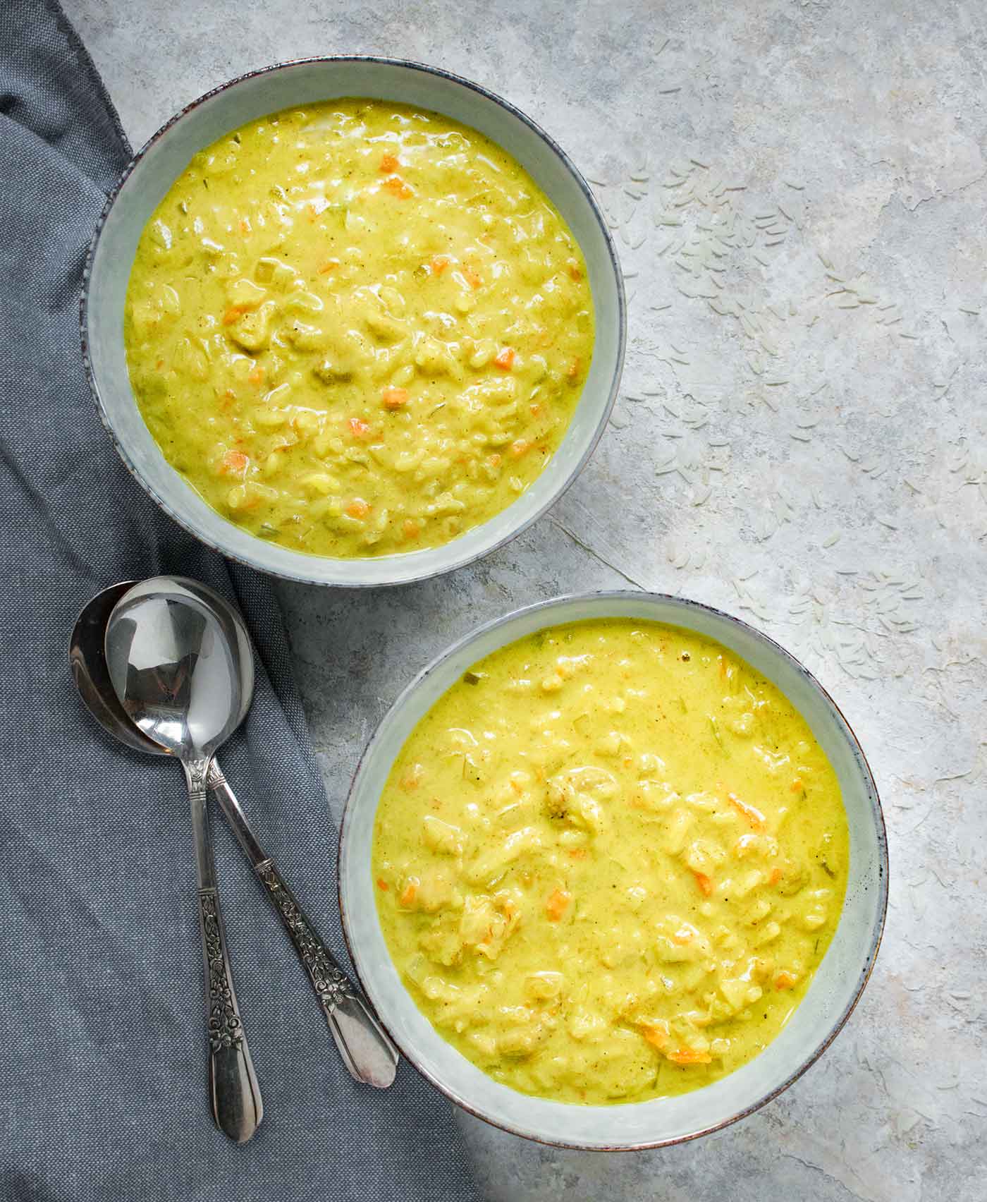 Two bowls of mulligatawny soup, ready to serve.