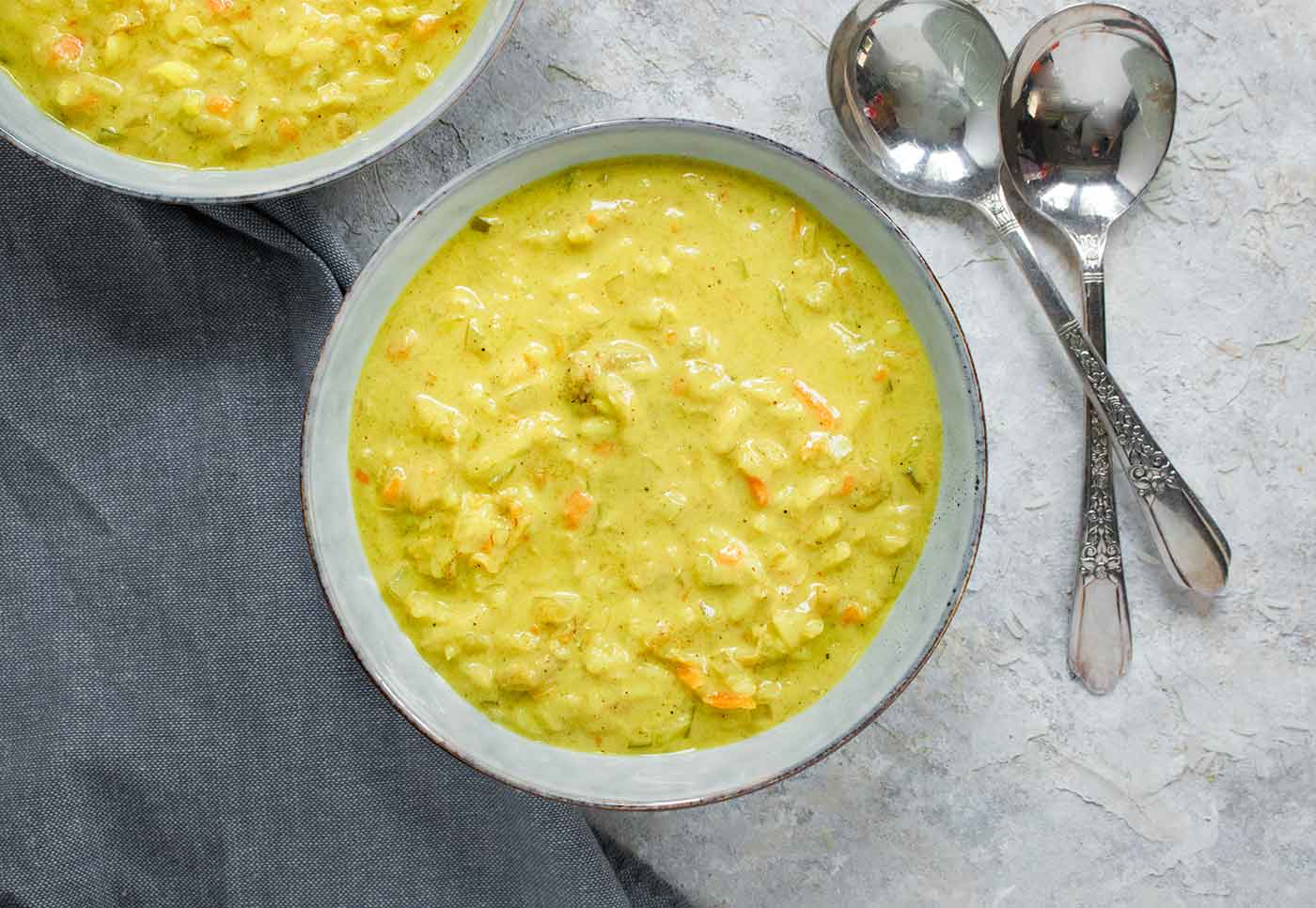 Mulligatawny soup in a light blue bowl.