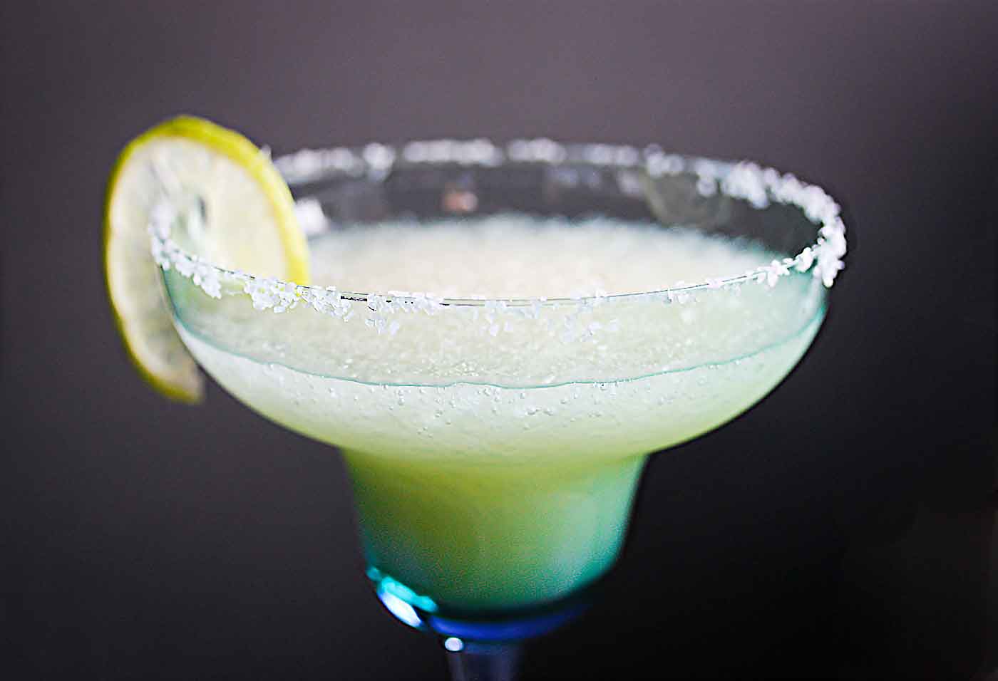 New Year's Margarita with a lime wedge in a glass