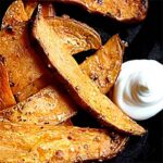 Savory sweet potato fries with sour cream on the side