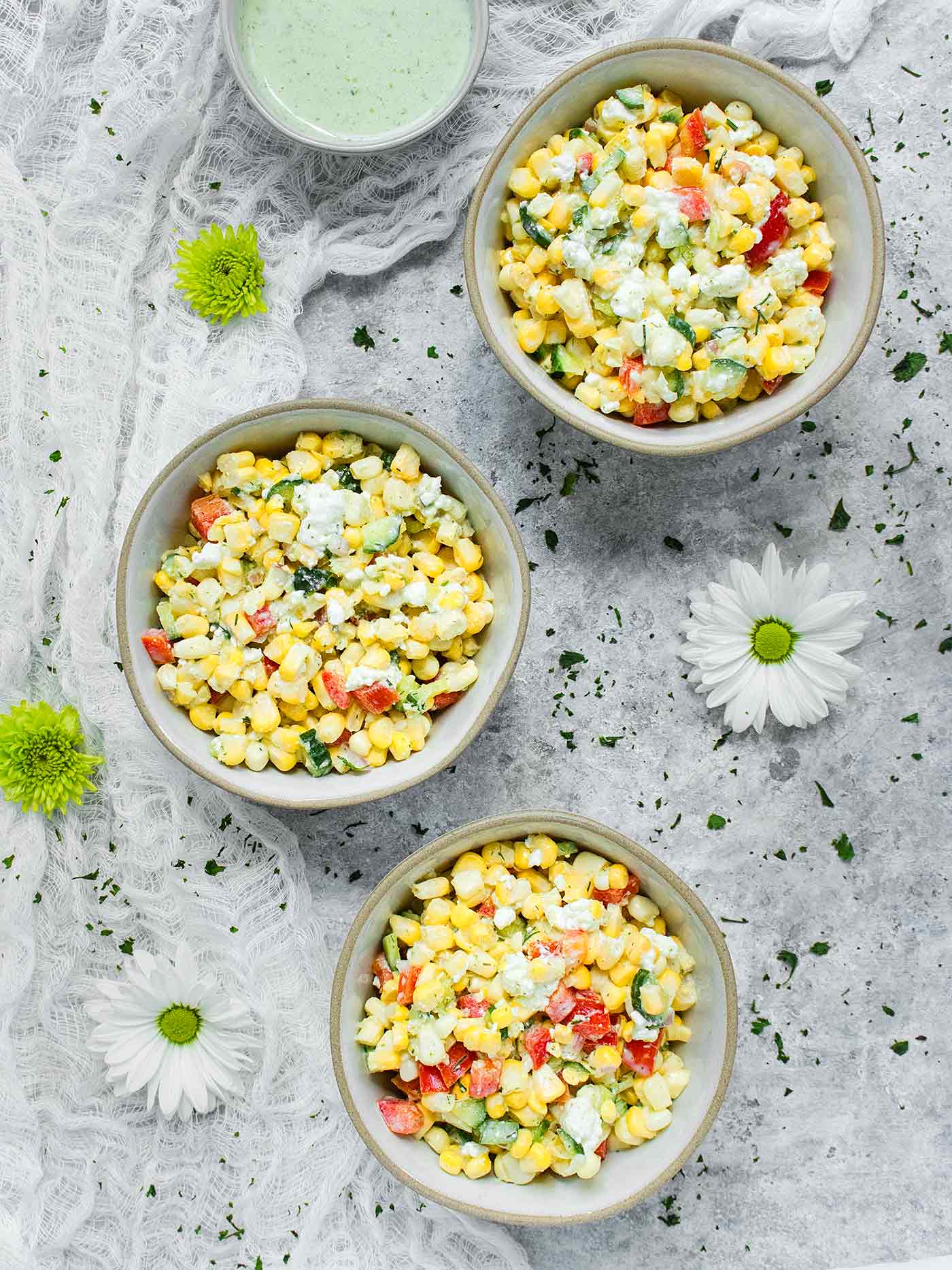Three small bowls of Sweet Corn Salad