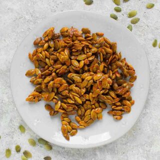 Honey Sriracha Roasted Pumpkin Seeds on a plate