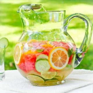 Homemade vitamin water, fruit infused water in a pitcher | Recipe at SoupAddict.com
