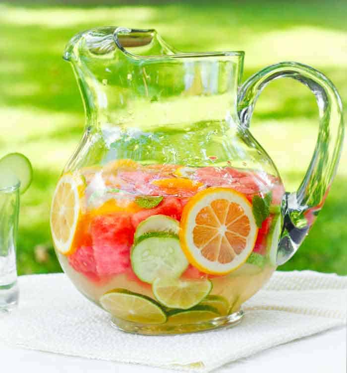 Homemade vitamin water, fruit infused water in a pitcher | Recipe at SoupAddict.com