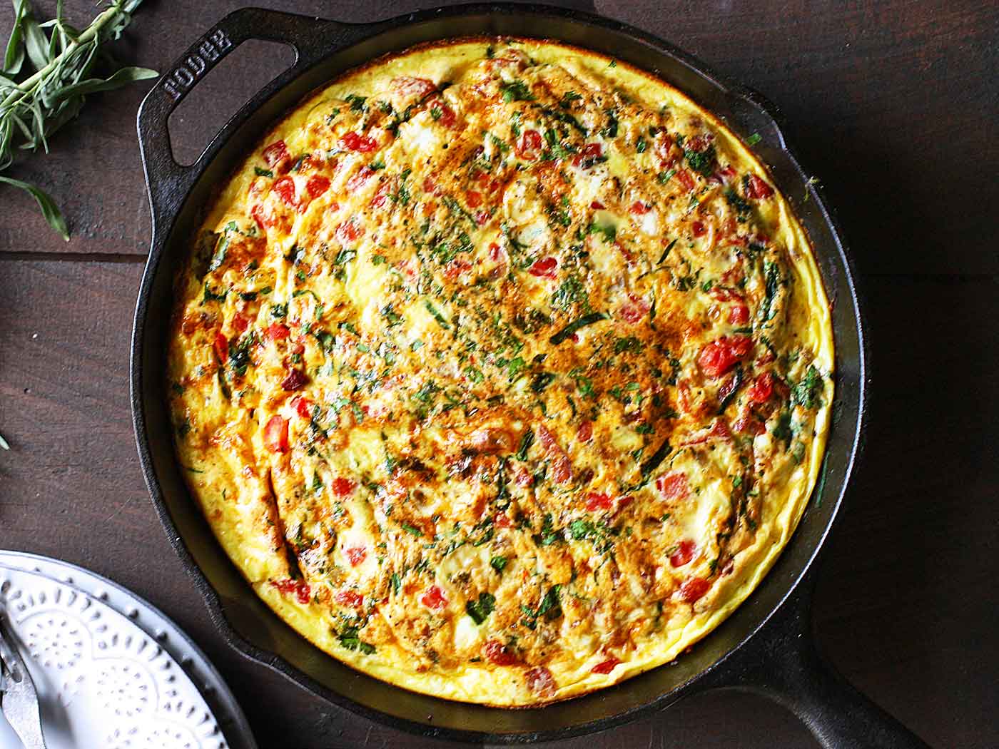 Overhead view of BLT Frittata in a cast iron skillet.