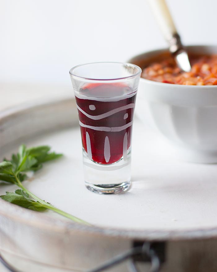 A shot glass with Cannonau red wine