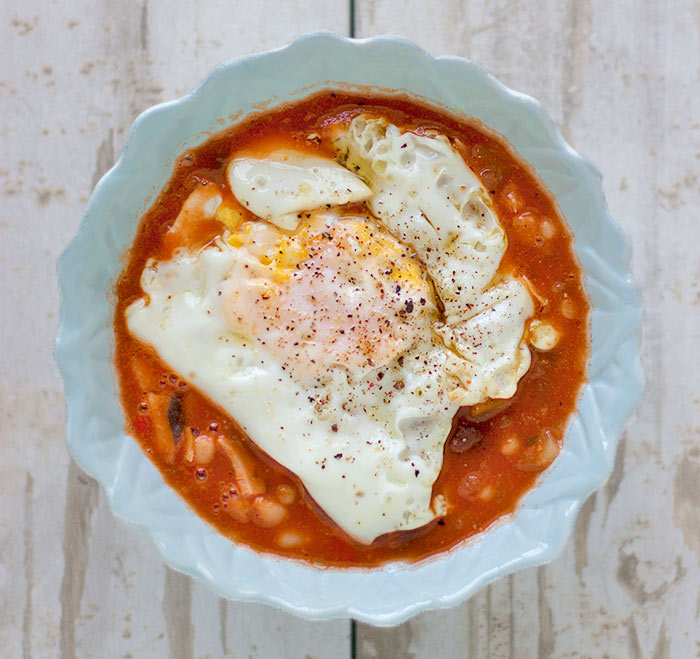 A bowl of Sardinian Minestrone soup served with a fried egg on top
