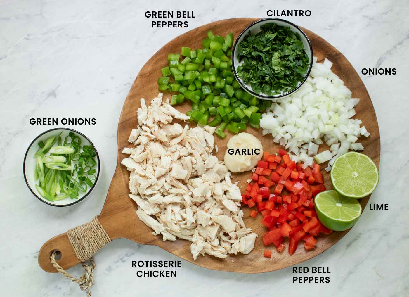 Prepped ingredients arranged on a wooden board.