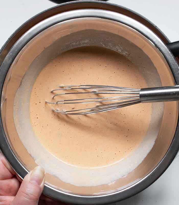 Temper the sour cream with some hot soup, whisking until smooth.