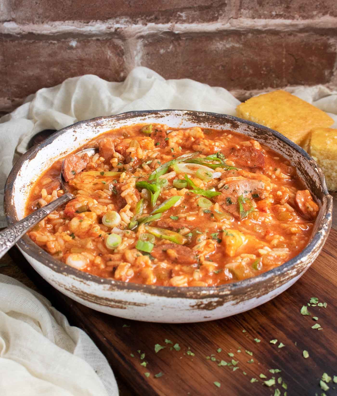 Side-angled view of a bowl of Jambalaya Soup.