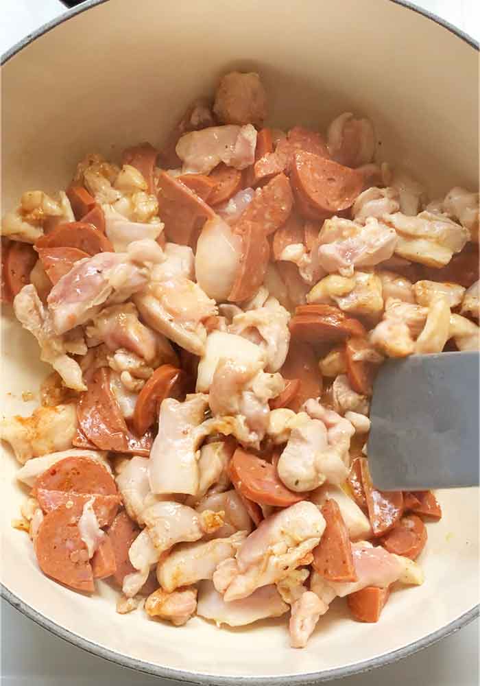 Andouille sausage browning with the chicken.