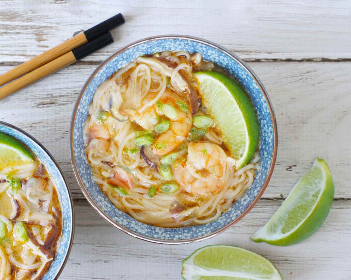 Thai Curry Shrimp Soup with noodles in a blue bowl.