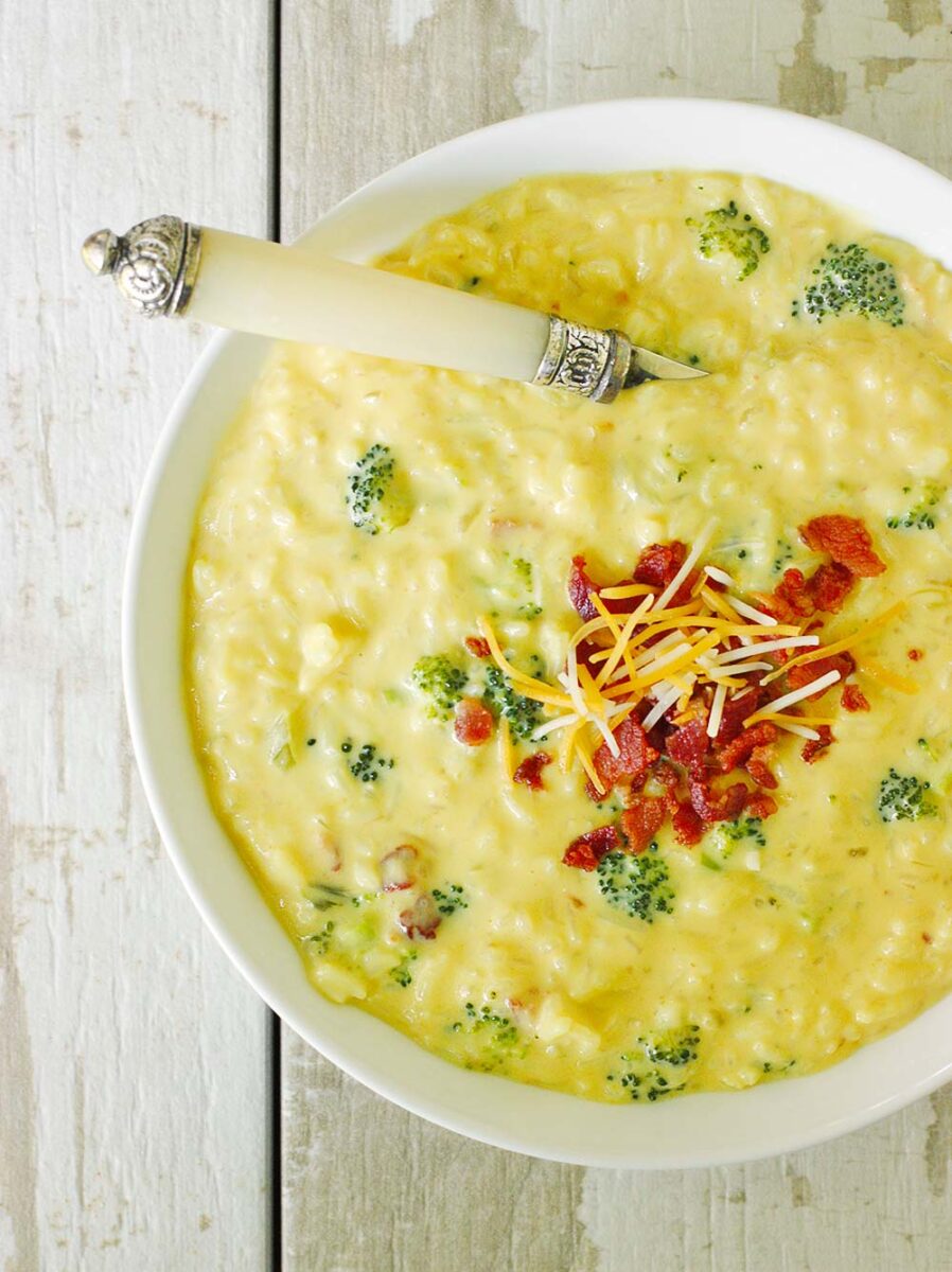 Overhead view of a bowl of Cheesy Broccoli Rice Soup.