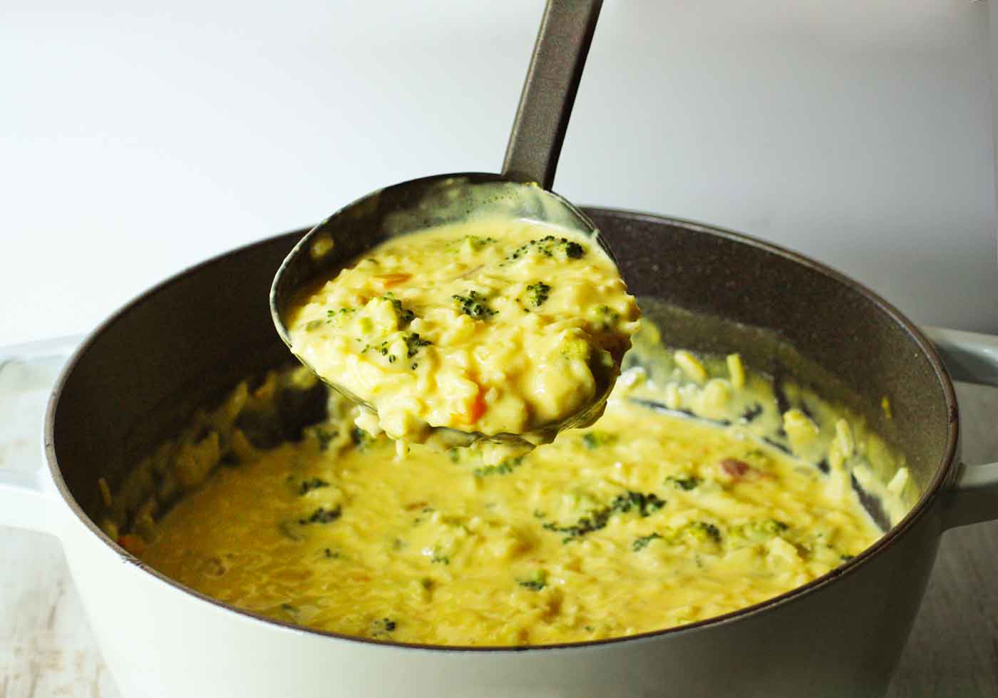 A ladle full of soup.