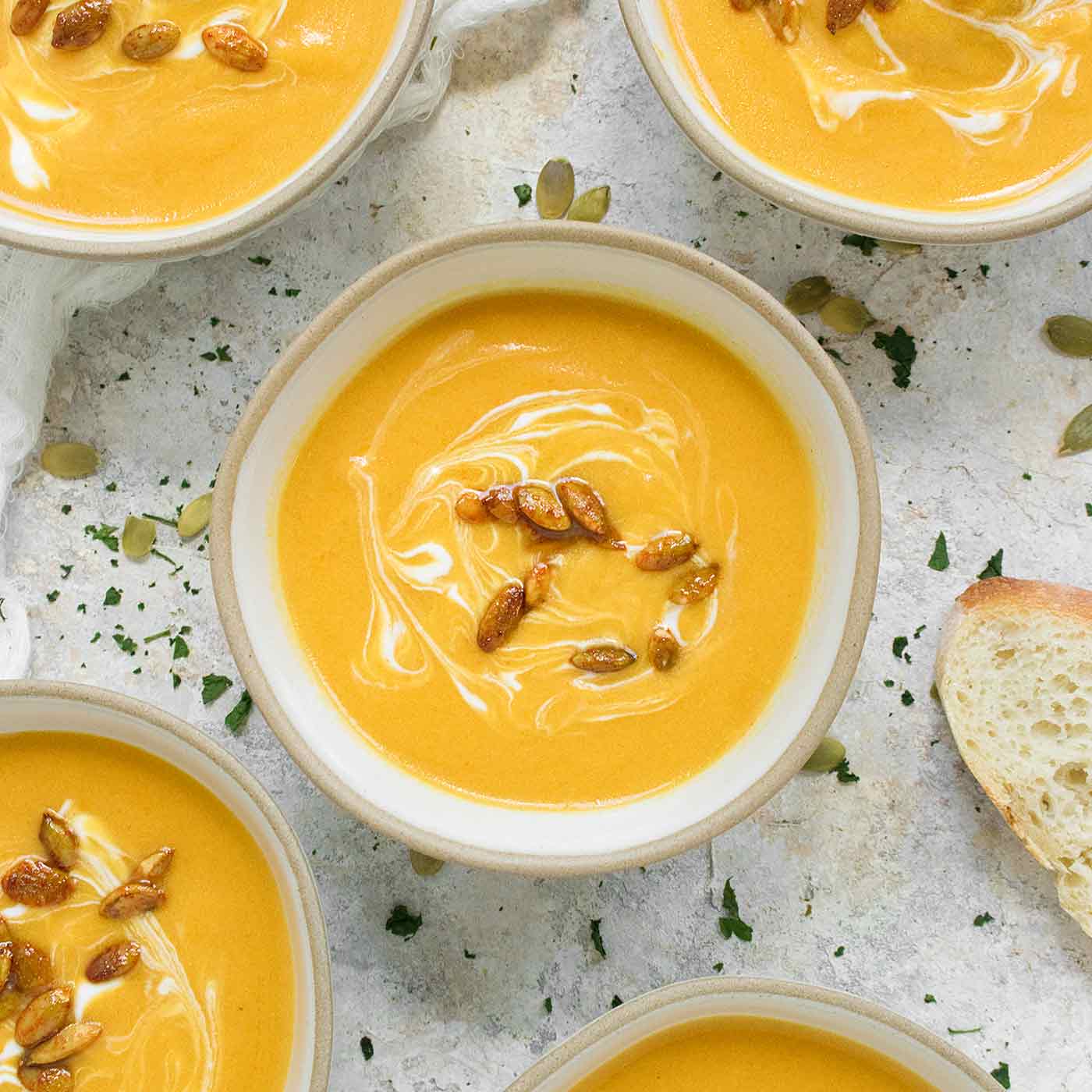 A bowl of Panera Autumn Squash Soup topped with toasted pepitas