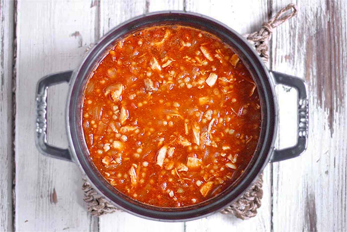 Overhead view of a pot of Moroccan Chicken Soup.