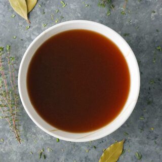 A bowl of roasted vegetable broth.