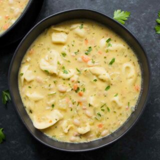 Creamy white bean tortellini soup in a bowl