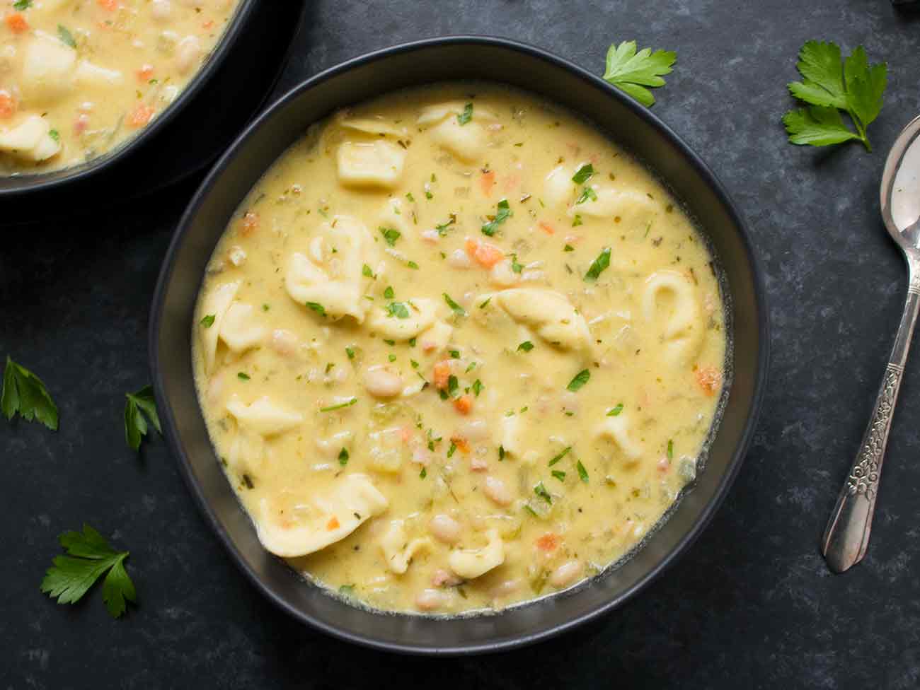 Creamy white bean tortellini soup in a bowl