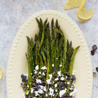 Roasted asparagus on a serving platter.