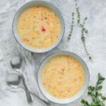 Two bowls of Smoky hatch chile corn chowder, ready to serve