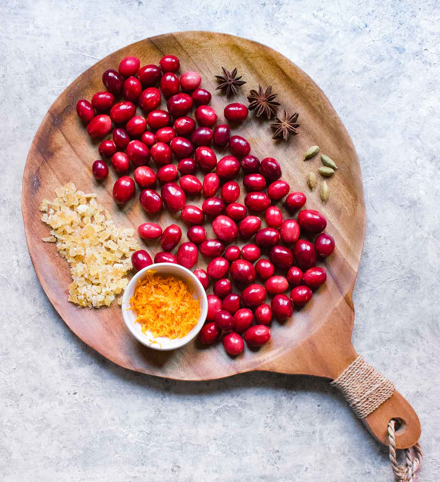 Ingredients for Instant Pot Spiced Cranberry Sauce on a serving board