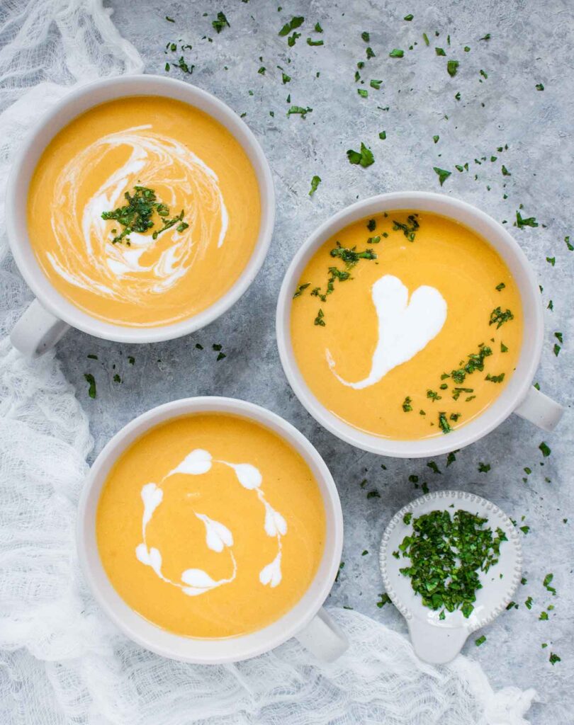 Three bowls of Carrot Lemongrass soup