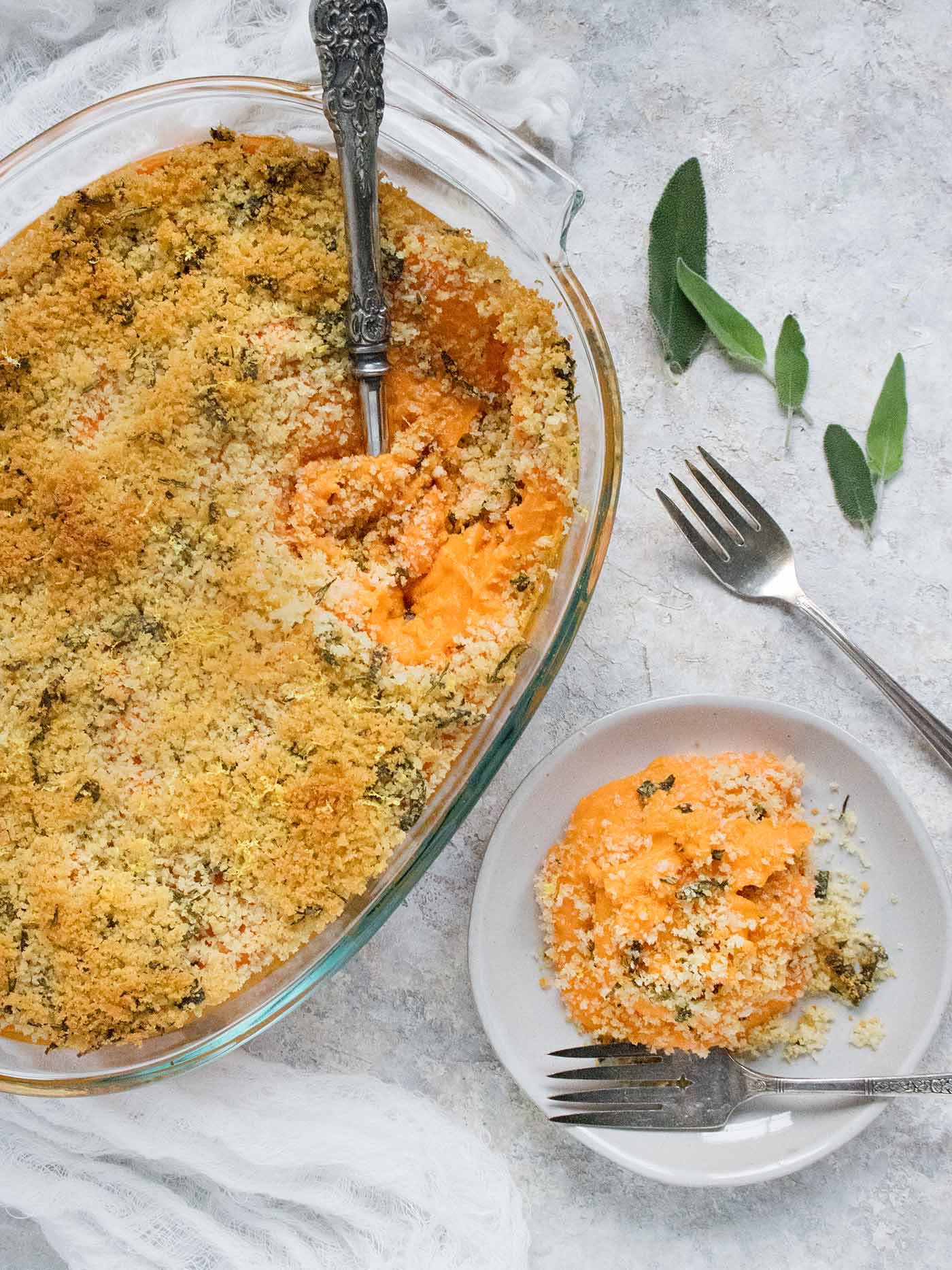 Savory Sweet Potato Casserole in the dish and on a plate