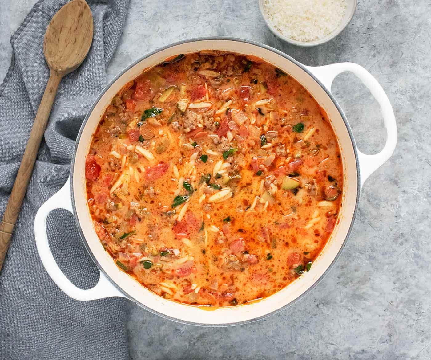 Overhead view of a pot of Italian Sausage Orzo Soup.