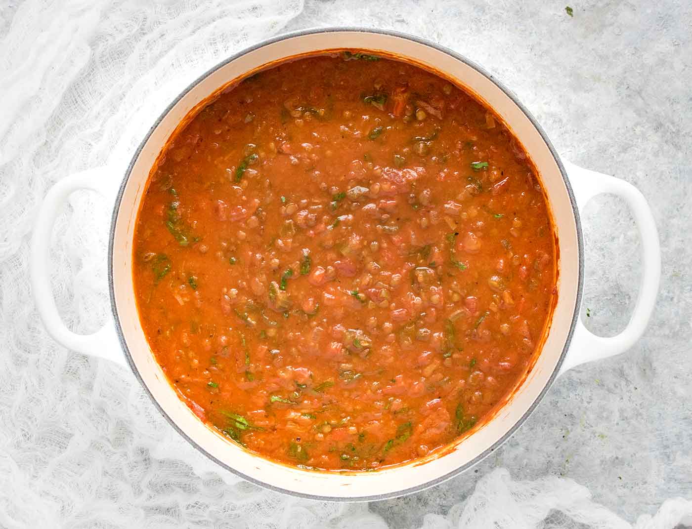 Creole Lentil Soup in a white Dutch oven