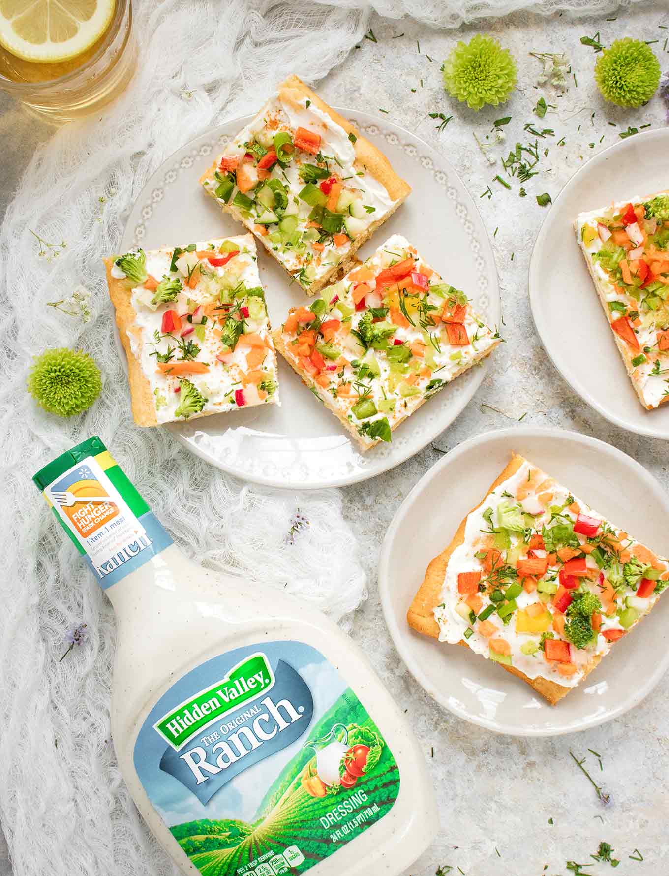 Ranch Veggie Pizza Appetizer served on plates, next to a bottle of Hidden Valley Ranch Dressing