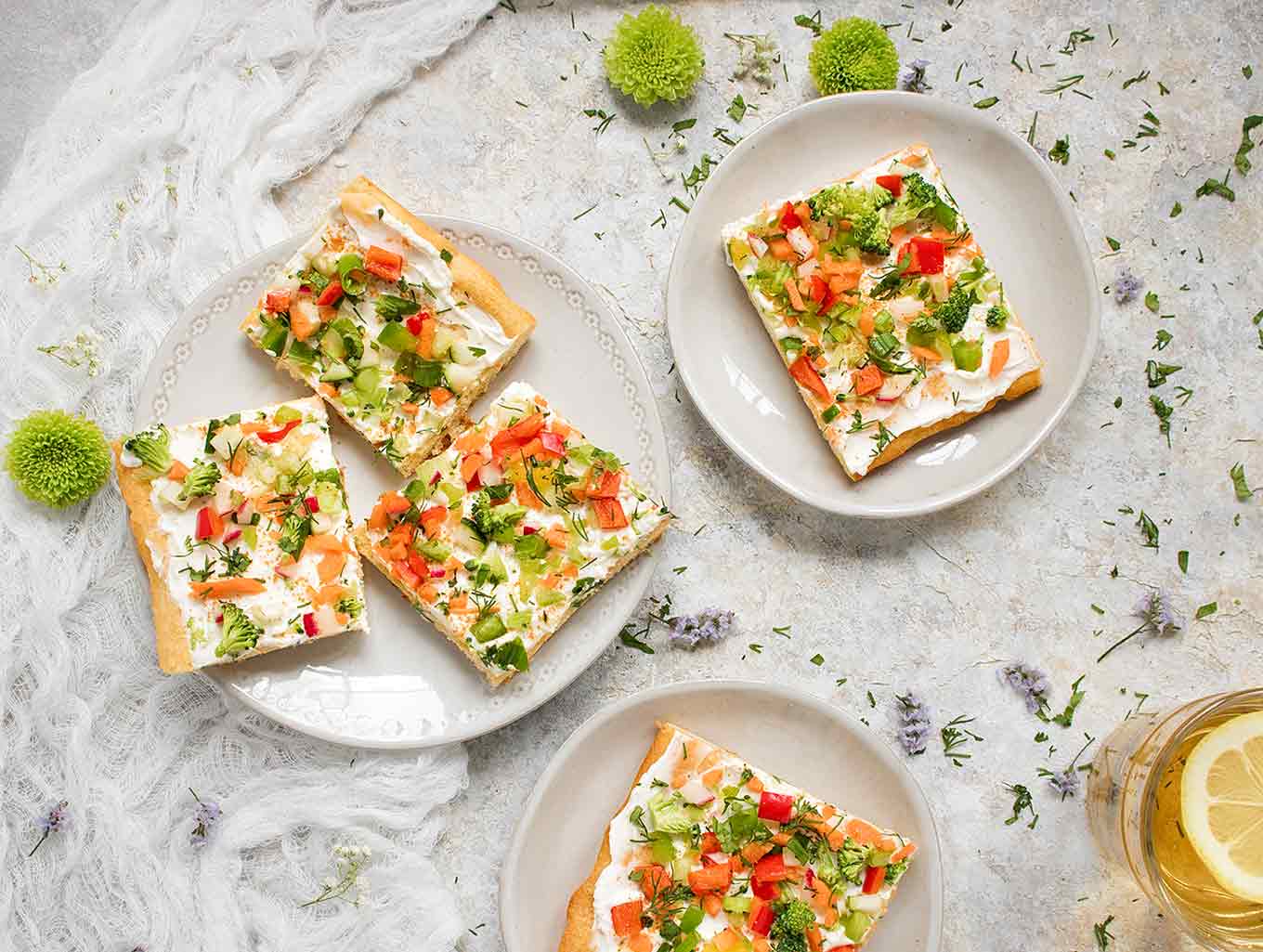 Ranch Veggie Pizza Appetizer cut into squares and served on small plates