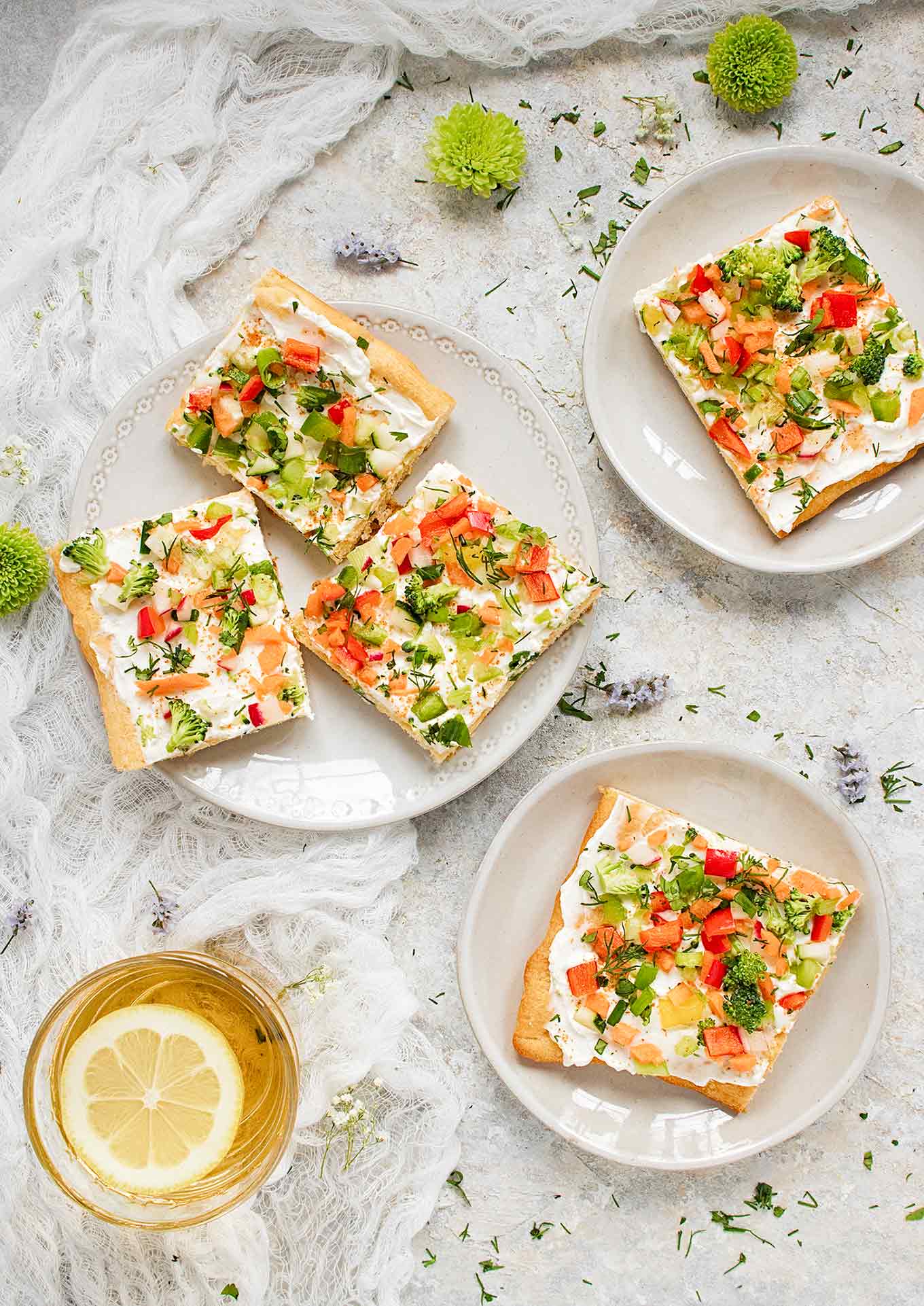 Appetizer plates filled with Ranch Veggie Pizza squares