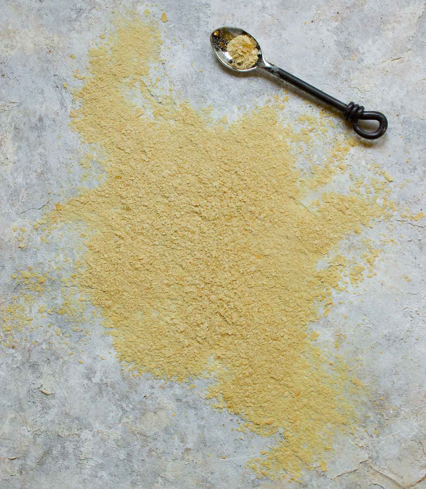 Nutritional yeast flakes scattered on the counter