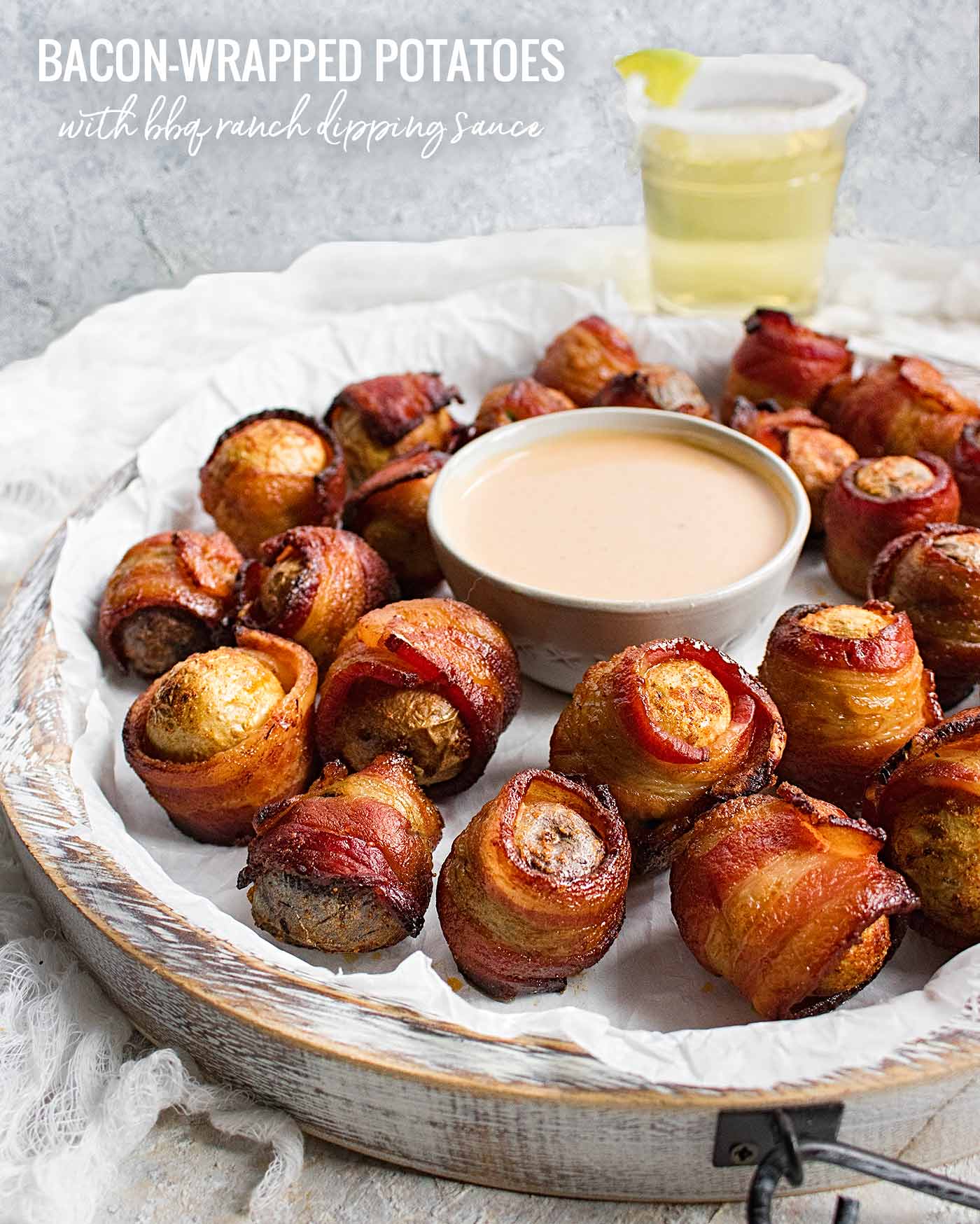 Bacon wrapped baby potatoes on a serving tray