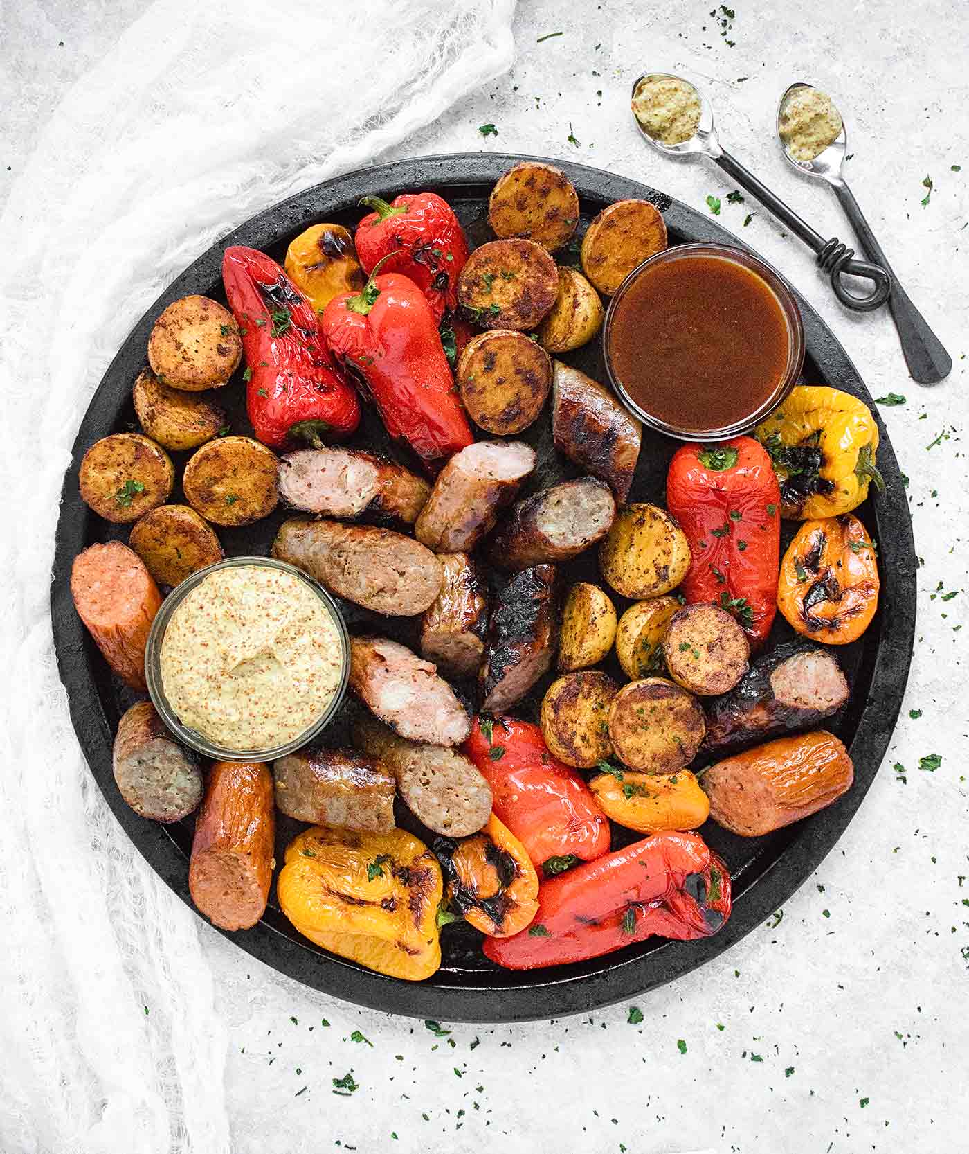 Grilled Sausages, Peppers & Potatoes with mustard and bbq dipping sauces