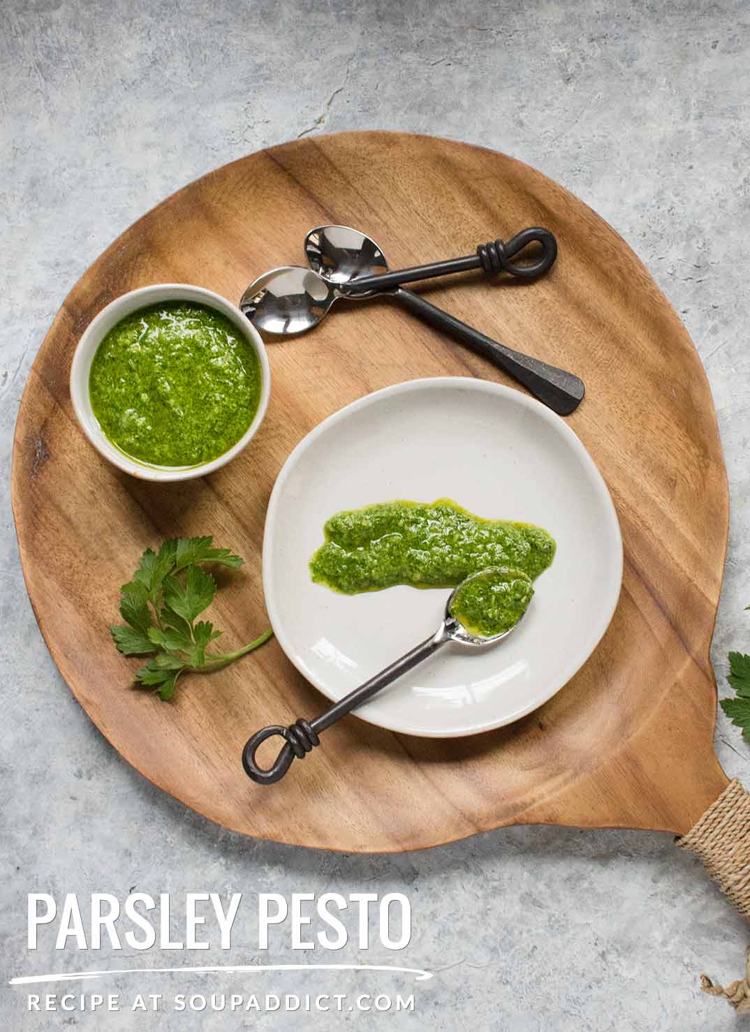 Parsley pesto in a bowl and spread on a small plate