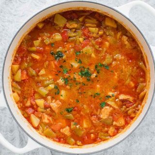 Green Chile Stew in a big white pot, ready to serve