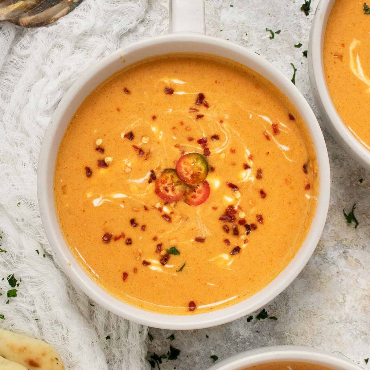 Square image featuring a bowl of Thai Pumpkin Soup.