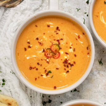 Square image featuring a bowl of Thai Pumpkin Soup.