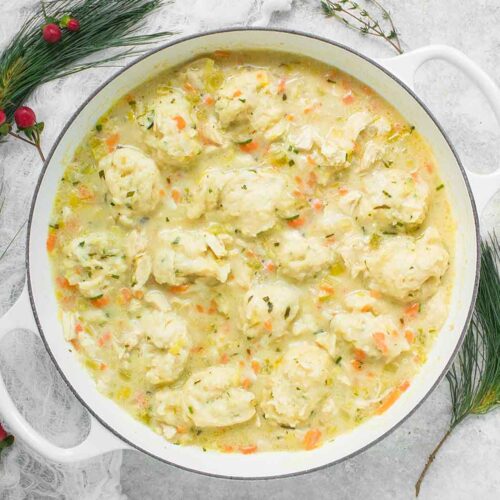 Chicken and Dumplings in a large white Dutch oven.