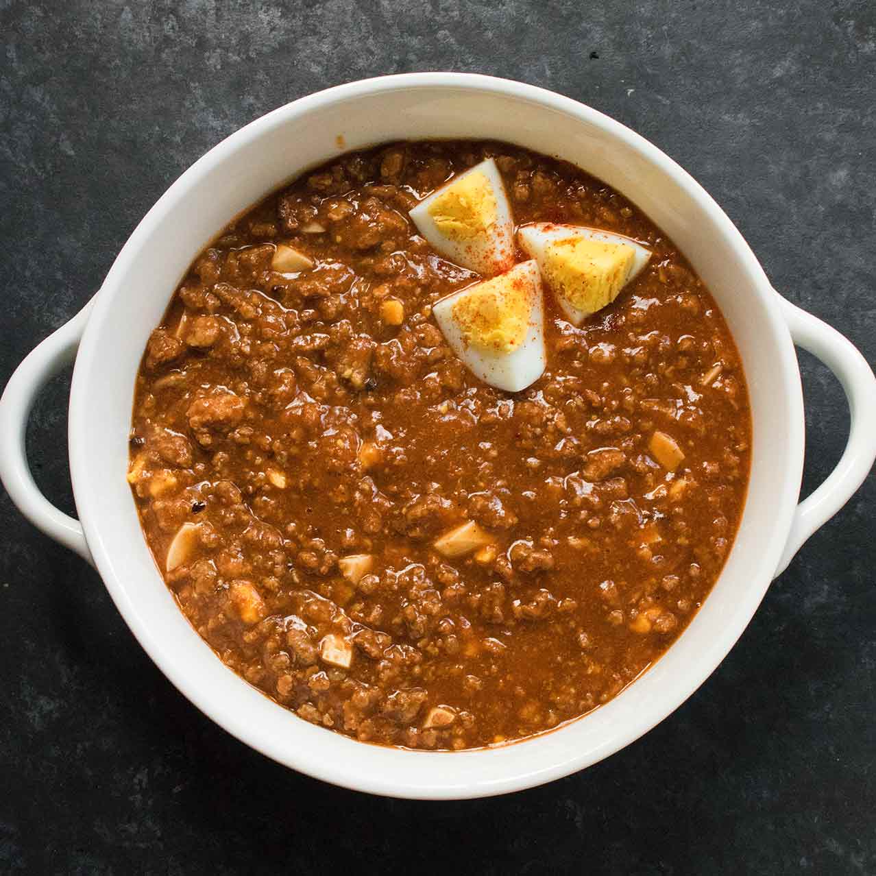 Mock Turtle Soup in a white bowl with a black background
