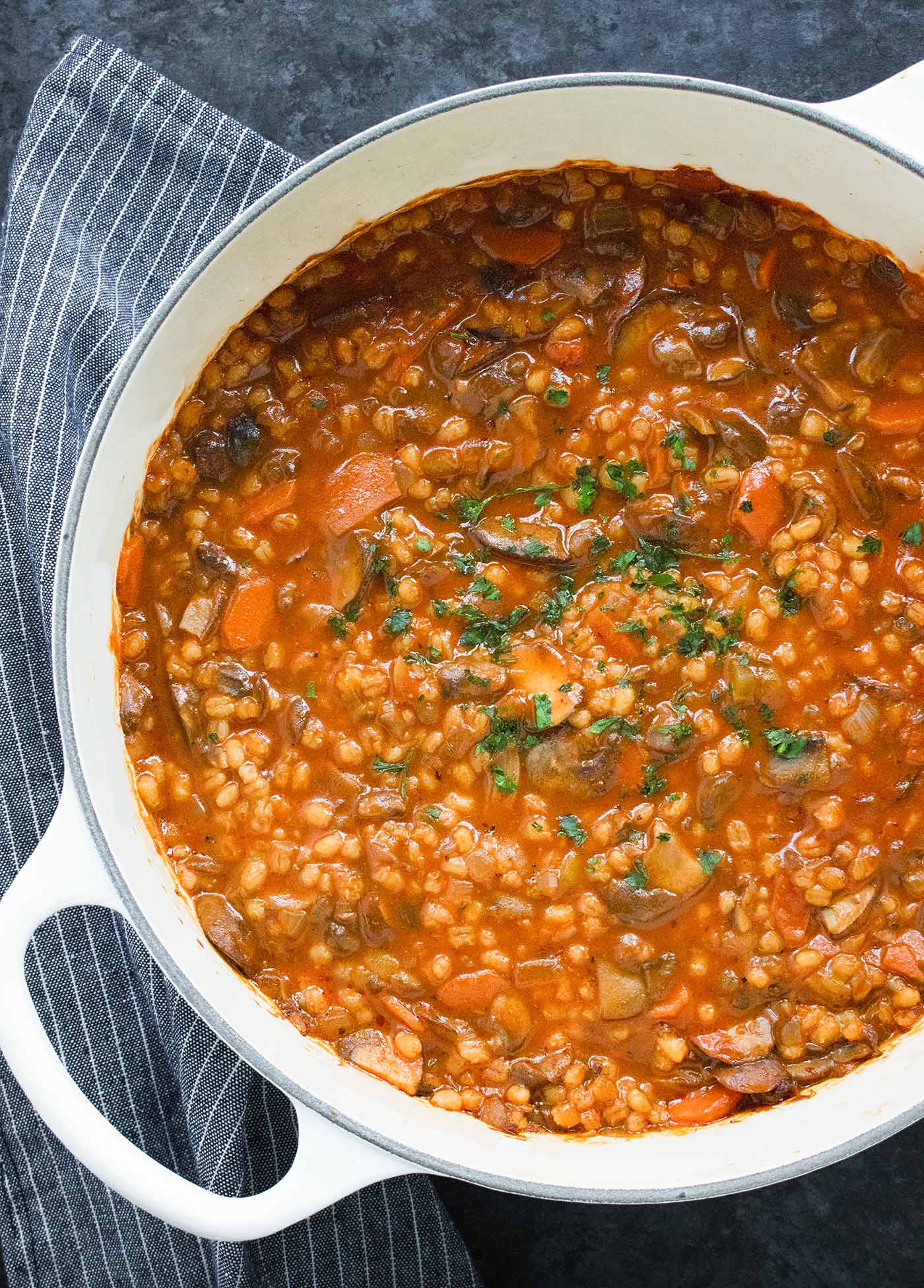 Mushroom Barley Soup in a white Dutch Oven