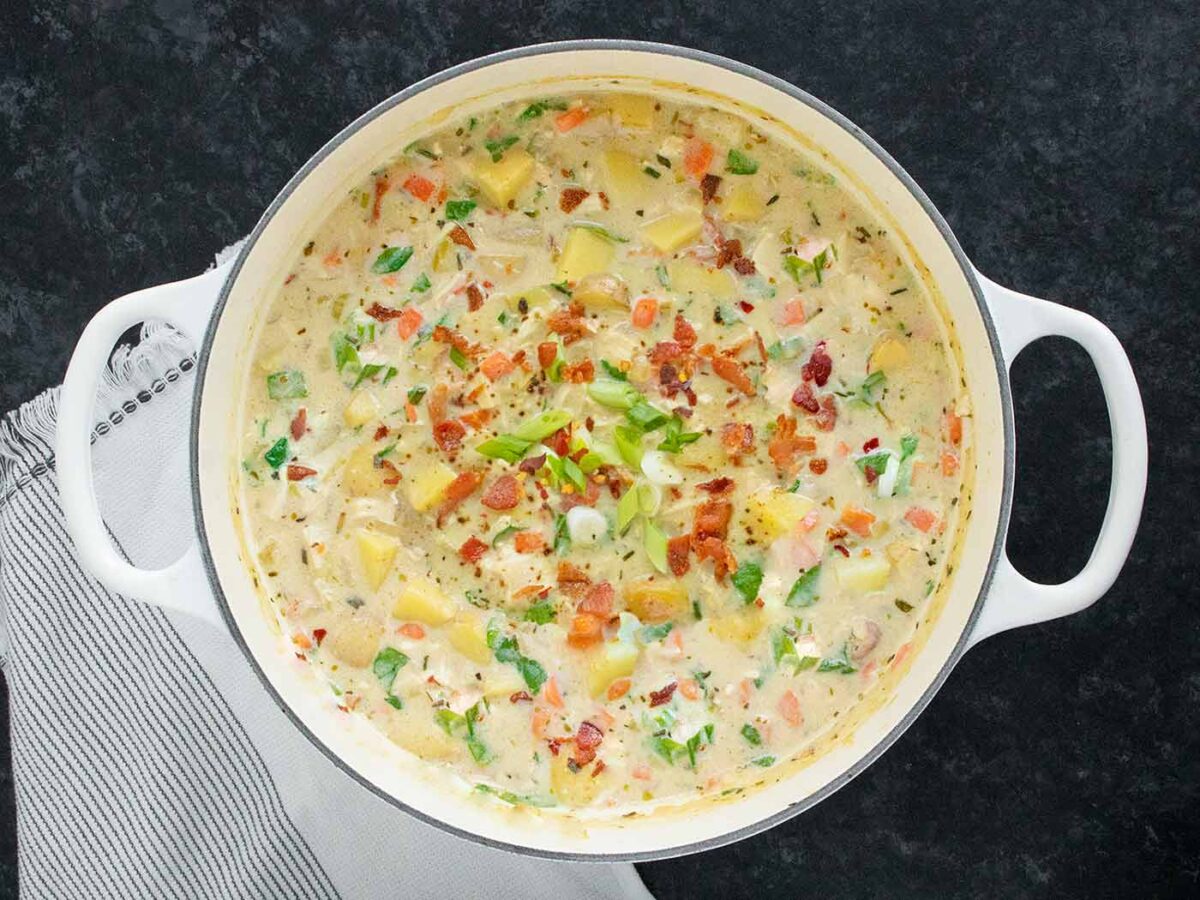 Overhead view of Chicken Potato Soup in a large white soup pot.