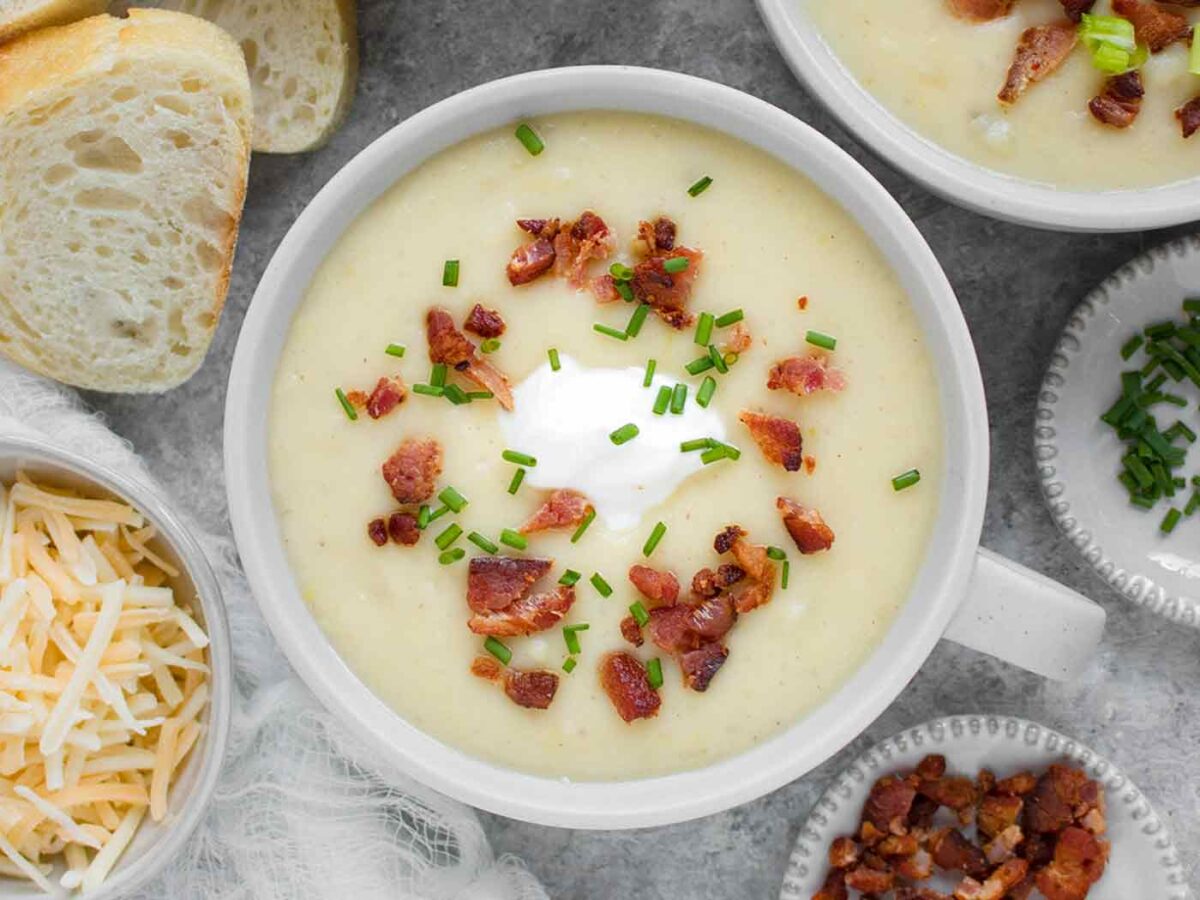 Overhead view of Instant Pot Loaded Potato Soup in a light gray bowl.