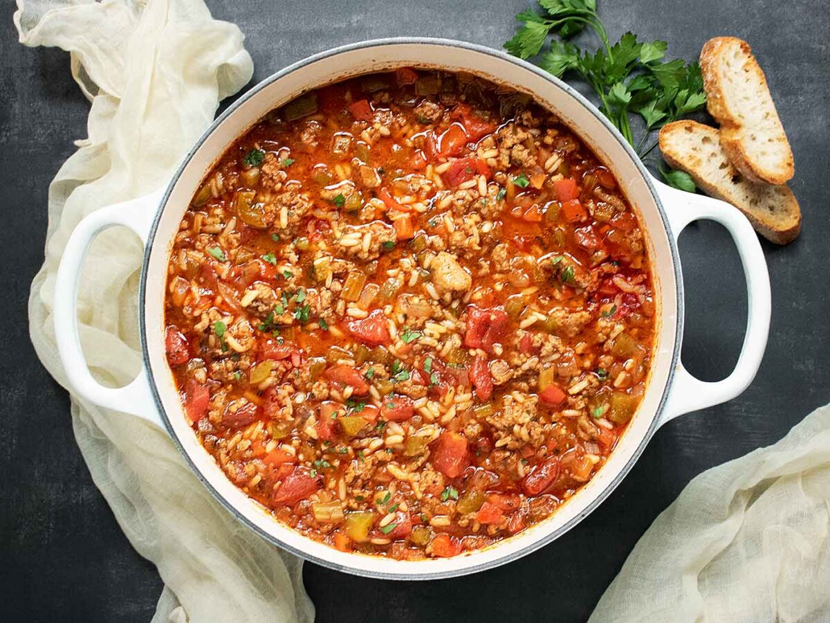 Photo from above of Stuffed Pepper Soup in a large white Dutch oven.