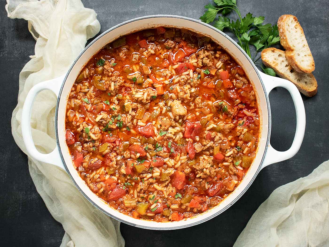 Photo from above of Stuffed Pepper Soup in a large white Dutch oven.