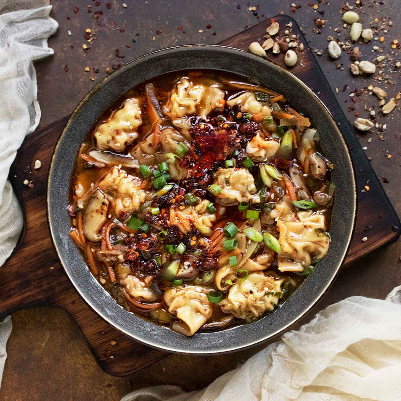 Potsticker Soup in a gray soup bowl.